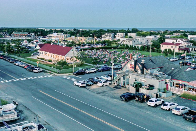 Aerial view of a restaurant and a recreation area full of people enjoying a concert