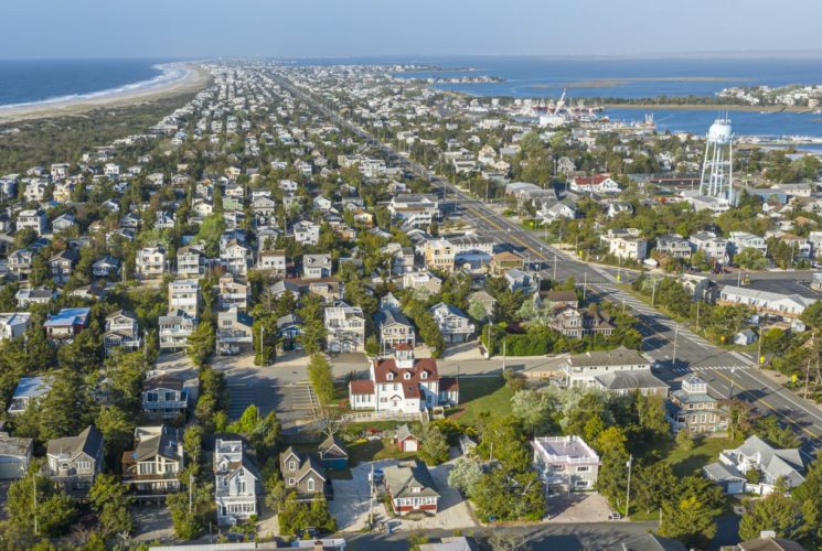 Aerial view of a coastal town with the ocean in the background