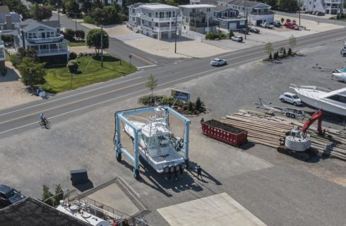 Aerial view of a boat out of the water being moved for service