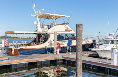 Man fueling boat in the harbor