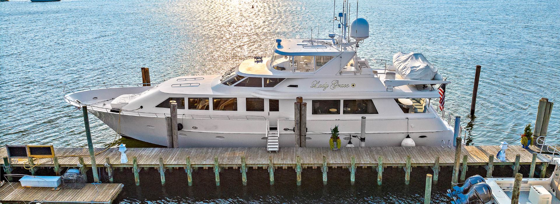 92-foot white yacht named Lady Grace on the water