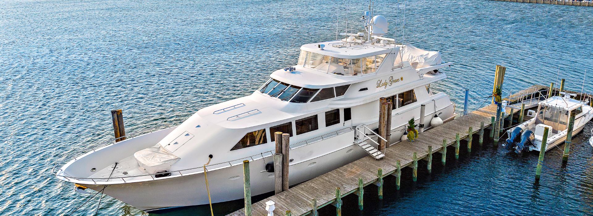 92-foot white yacht named Lady Grace on the water