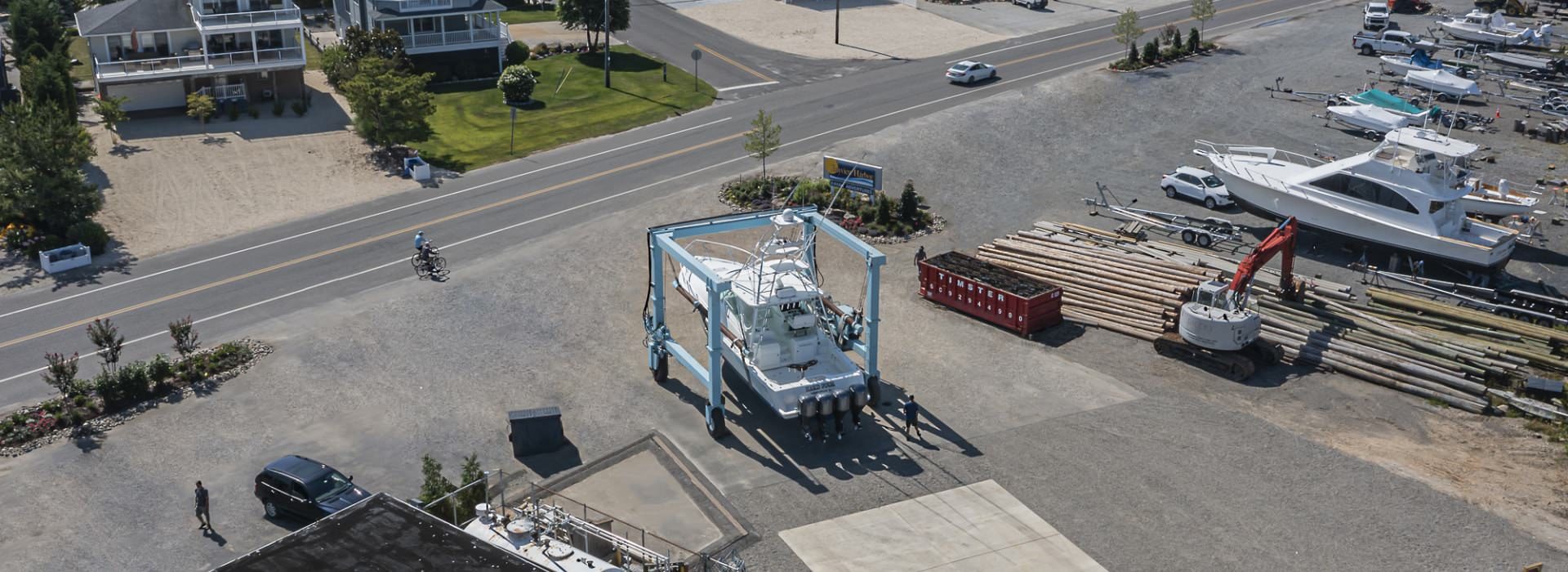 Aerial view of a boat out of the water being moved for service