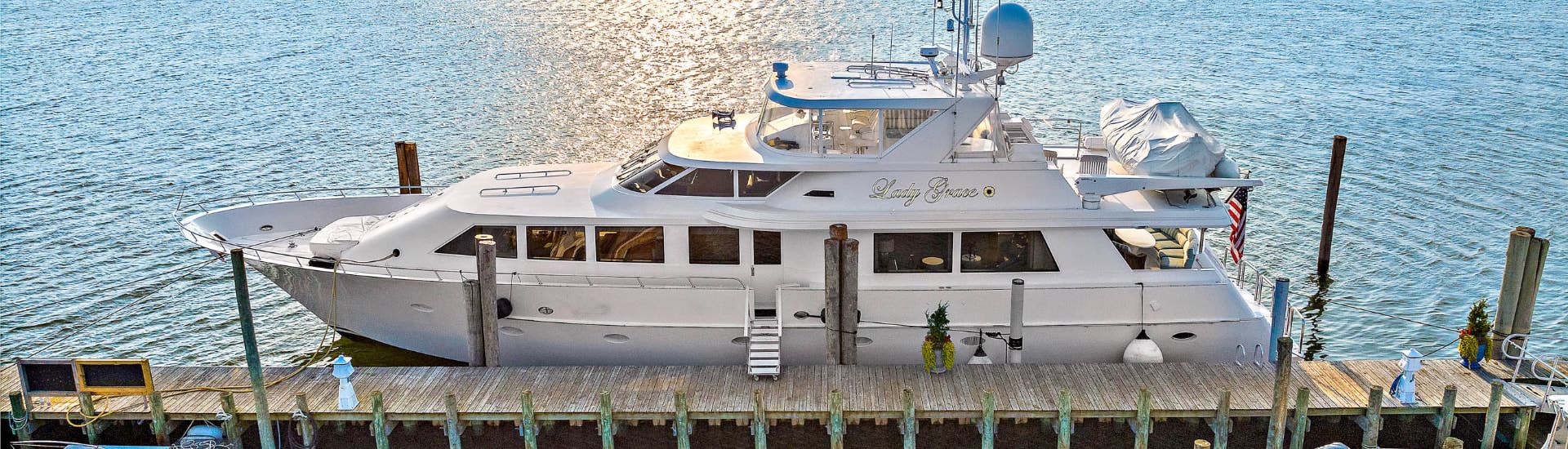 92-foot white yacht named Lady Grace on the water