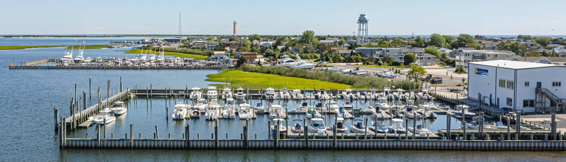 Aerial view of two harbors full of boats in a coastal town