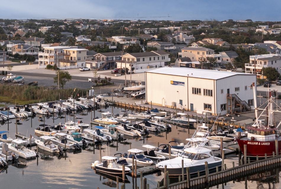 Aerial view of a harbor full of boats in a coastal town