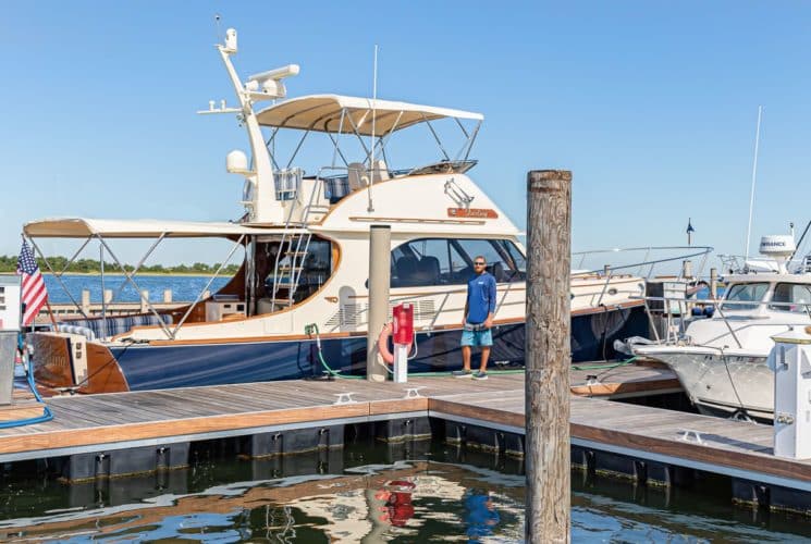 Man fueling boat in the harbor